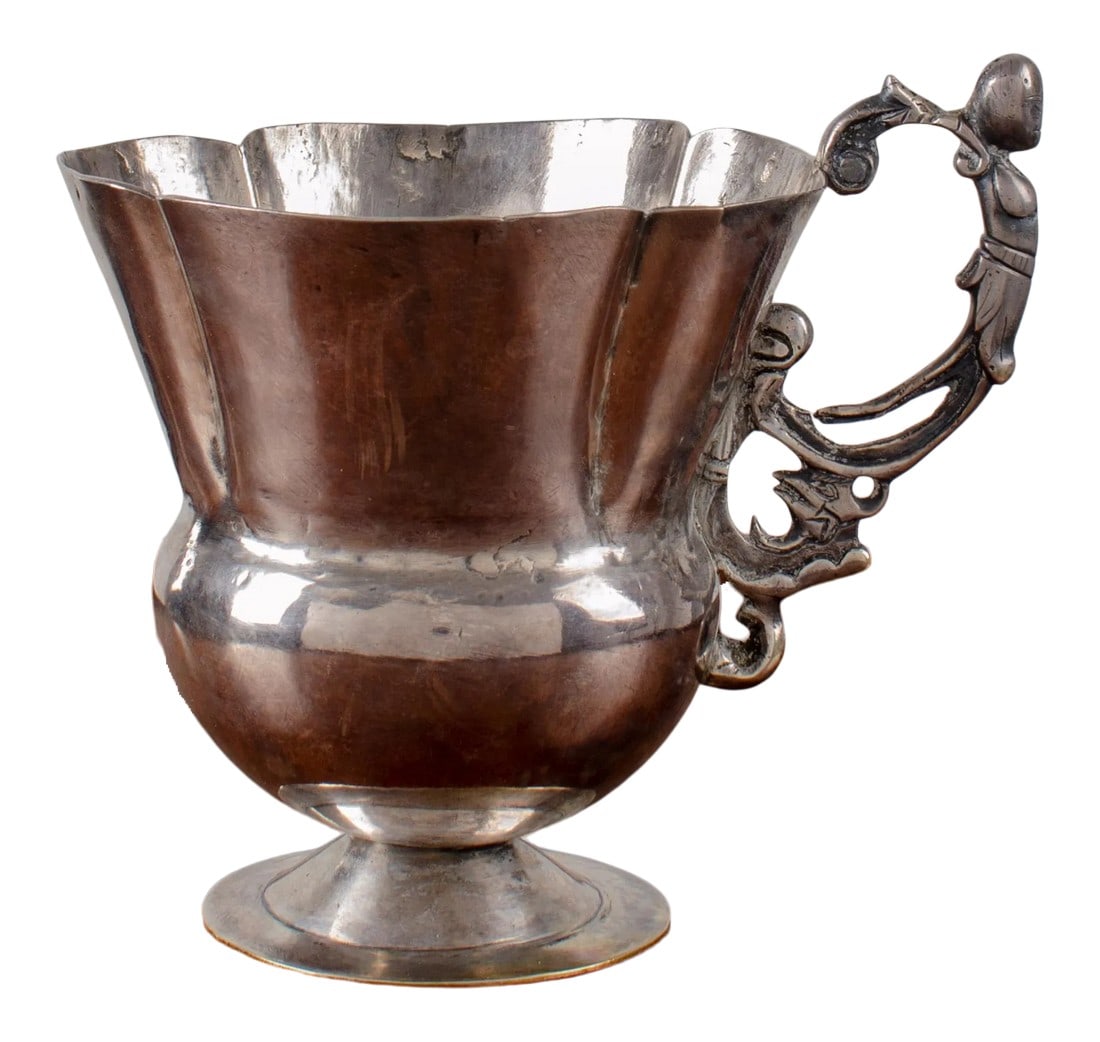 Spanish Colonial Silver Cup, 18th Century: An 18th century Spanish colonial silver cup with lobed rim and female figurehead handle. 5 Â½ inches wide by 4 â…œ inches deep by 4 Â¼ inches tall Condition: