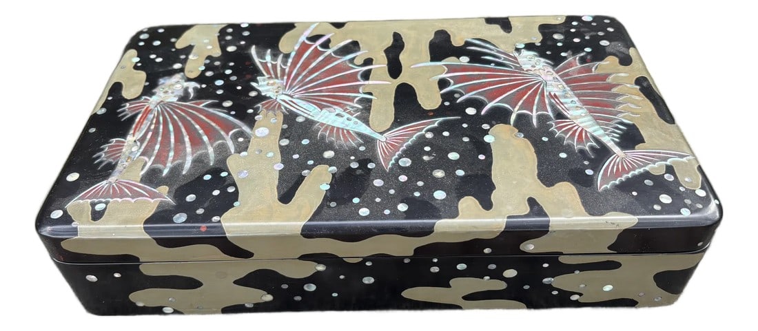 Antique Japanese Lacquered Box: Antique Japanese Lacquered Box. Offered is a beautifully detailed Japanese lacquered box that dates to the 1920's. This decorative box is artfully decorated with a riparian theme features fish inlaid