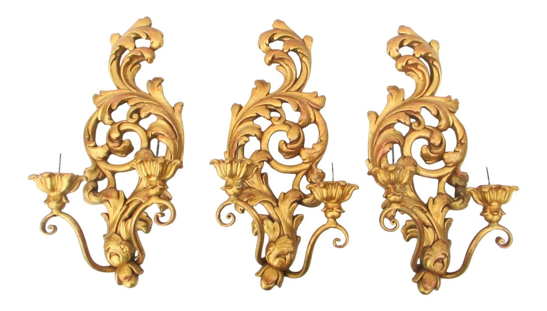 Vintage Italian Florentine Two-Candle Wall Sconces- Set of 3: Set of three Italian cast and gilt two candle wall sconces. Cast in resin and wood with electrical wiring added to the brass curled arms. Gold leaf finish over a red boul undercoat. Florentine-style