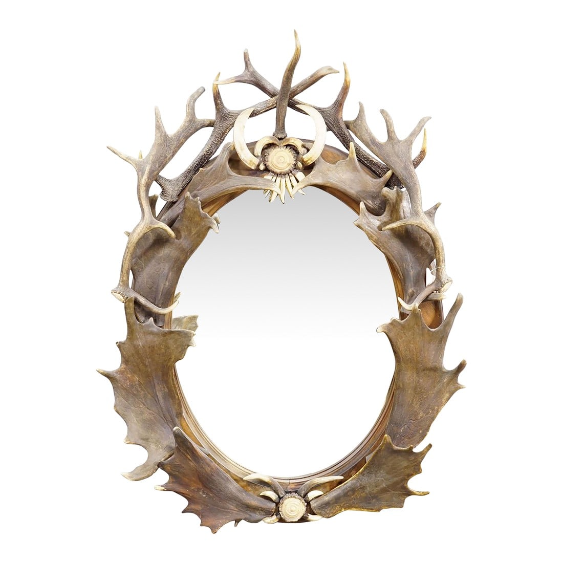 Antique Black Forest Mirror With Antler Arrangement Ca. 1920s: Antique Black Forest Mirror with Antler Arrangement ca. 1920s This striking wall mirror is framed with an elaborate arrangement of natural deer antlers, forming an oval surround of sculptural depth an
