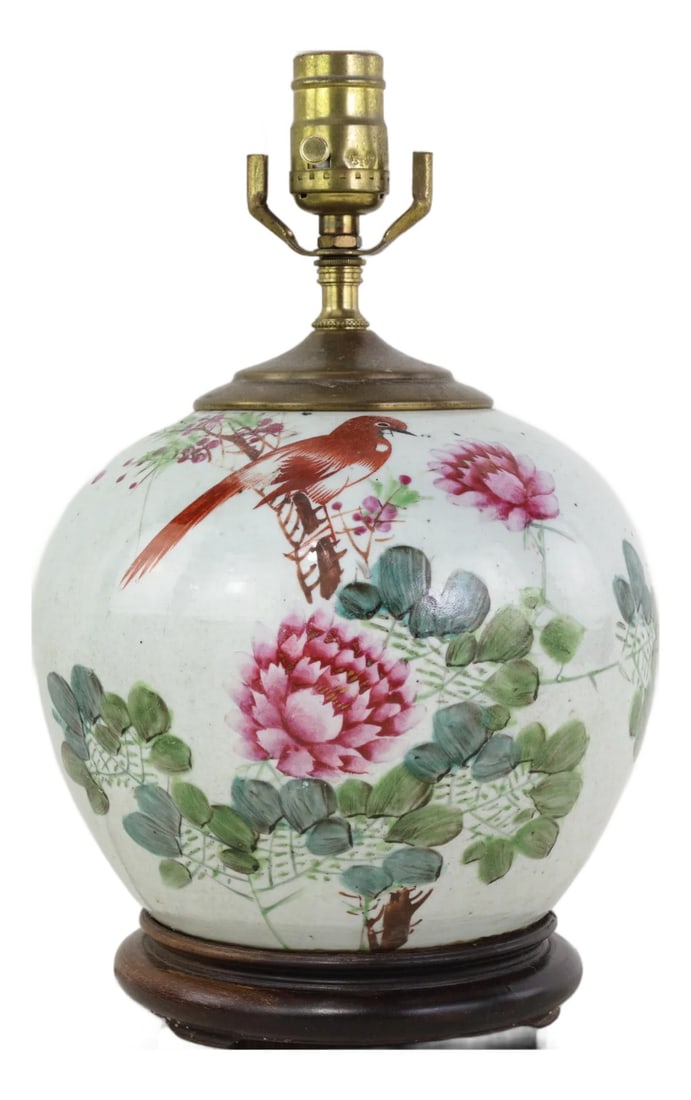 Famille Rose Antique Porcelain Vase Table Lamp With Bird and Peony Motif on Wood Base: This antique table lamp is crafted from an authentic porcelain vase featuring the vibrant Famille Rose palette. The classic rounded body is decorated with a detailed scene of a red long-tailed bird
