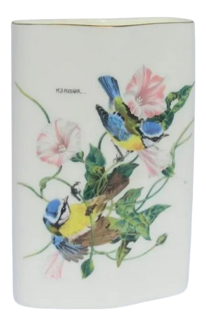 Mid-Century Japanese Porcelain Vase: Mid-century Japanese porcelain flower vase in a diamond-shaped form. Floral spray with two blue jays play in the leaves. Signed to the underside. Japan with a Japanese character mark to the center.