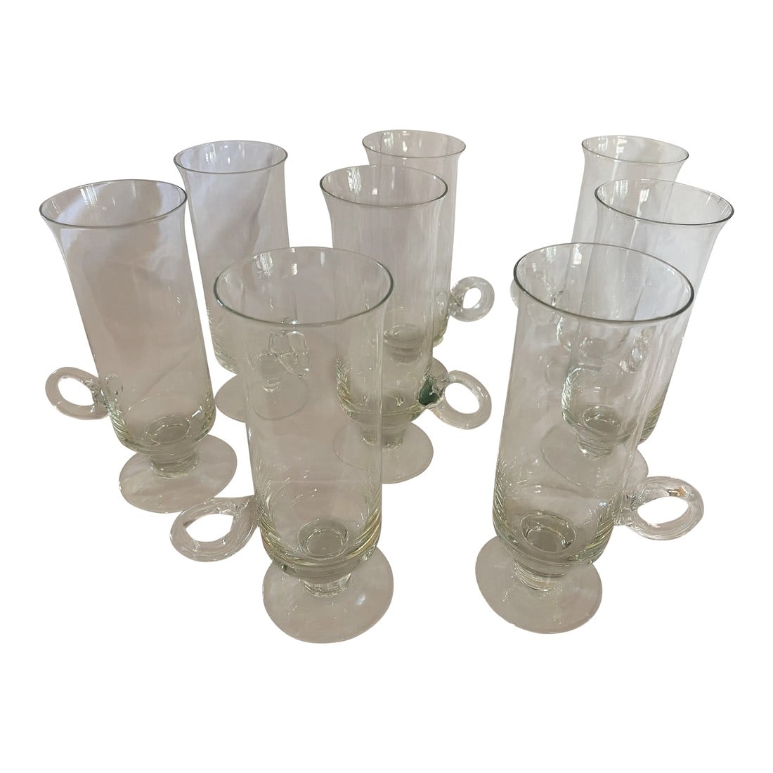 Mid-Century Modern Handled Glasses- Set of 8: Set of eight mid-century handled glassware set. They feature an interesting snake-like handle. Very mid century modern. Could be used for hot or cold drinks. Tall, slightly fluted, thin and delicate g