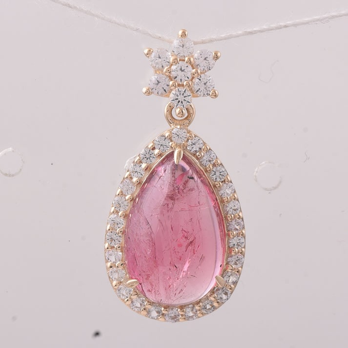 5.58 Ct Pear Tourmaline 9K Gold Pendant: 5.58 Total Carat Tourmaline 9K Gold Pendant Specifications: Total Weight 2.183 g Center Gemstone Tourmaline Gemstone Carat Weight 4.85 Carats Gemstone Measurements 14X9X5 mm Additional Gemstones White