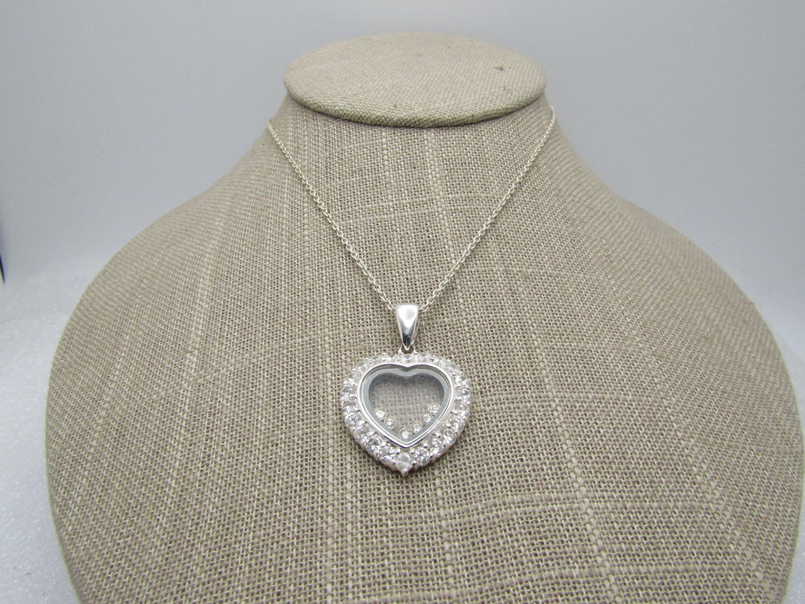 Marked Sterling Heart Rhinestone Necklace, 18", 1990's, Signed: Title: Marked Sterling Heart Rhinestone Necklace, 18", 1990's, Signed Description: Marked Sterling Floating Heart Rhinestone Necklace, 18", 1990's, Signed SA and marked China. Open heart center that i