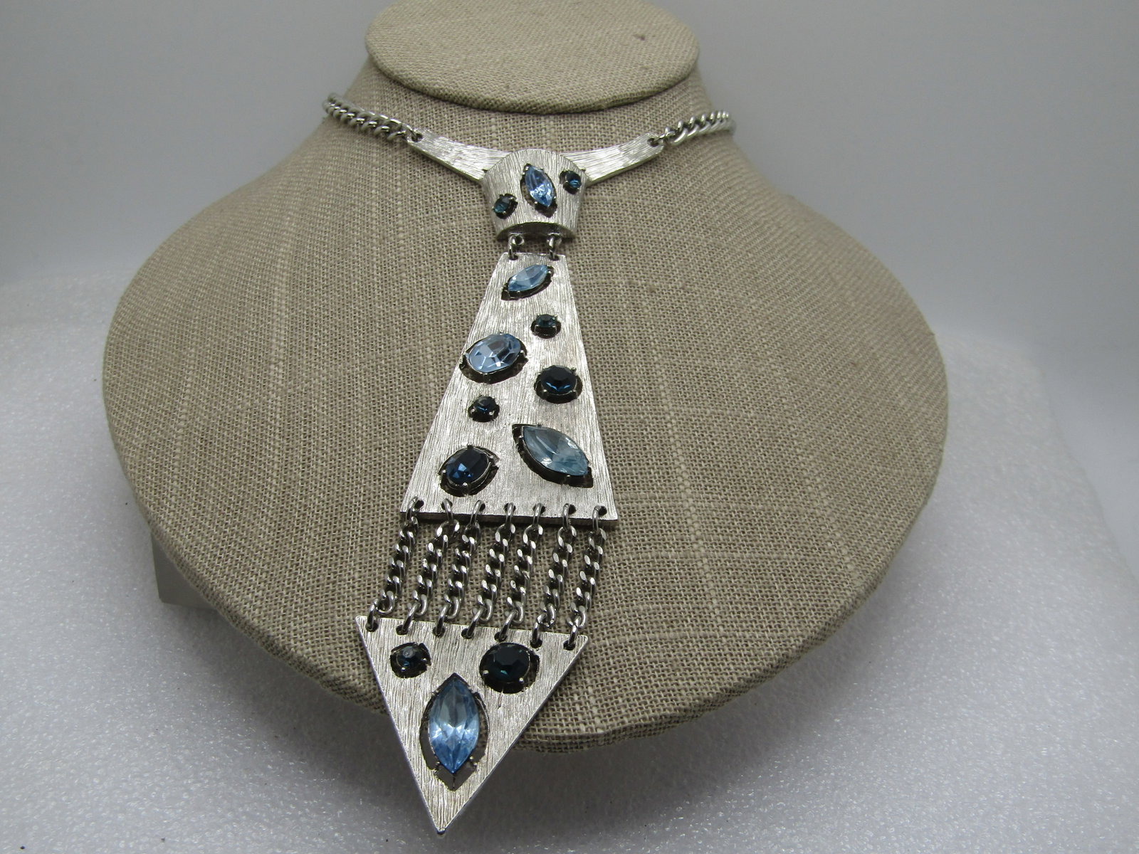 Vintage Blue Rhinestone Tie Necklace, 1960's-1970's, 15.5": Title: Vintage Blue Rhinestone Tie Necklace, 1960's-1970's, 15.5" Description: Vintage Blue Rhinestone Tie Necklace, 1960's-1970's, 15.5". Hook clasp, silver tone chain that is appx. 4.5mm wide. The