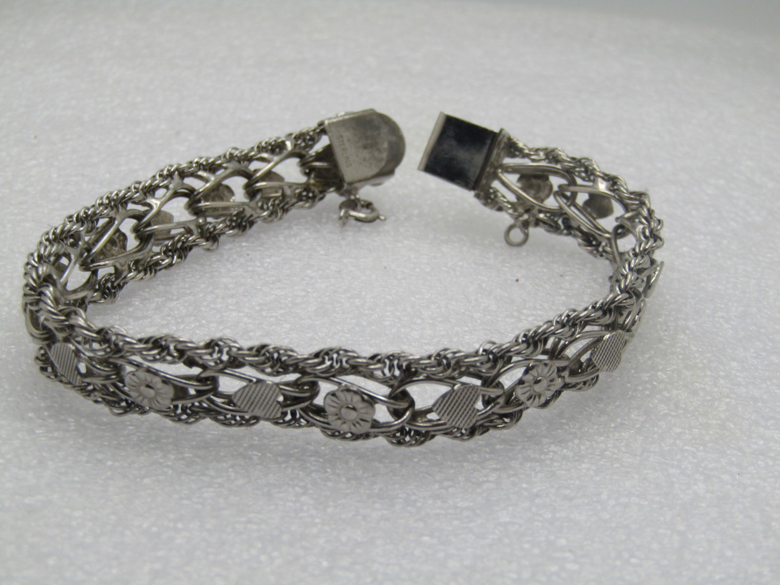 Vintage Sterling Hearts & Flowers Wide Bracelet, 7.5", Signed R, 1970's: Title: Vintage Sterling Hearts & Flowers Wide Bracelet, 7.5", Signed R, 1970's Description: Vintage Sterling Hearts & Flowers Wide Bracelet, 7.5", Signed R, 1970's. This is appx. 10.5mm wide with a