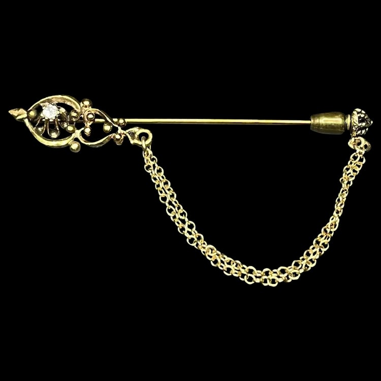 Vintage Royal Scepter Diamond Stickpin with Chain: Title: Vintage Royal Scepter Diamond Stickpin with Chain Description: Vintage Royal Scepter Diamond Stickpin with Chain. Hallmarked 14k Gold. Weighs 2 grams. Measures Approx. 2 x.25 Date/Period: