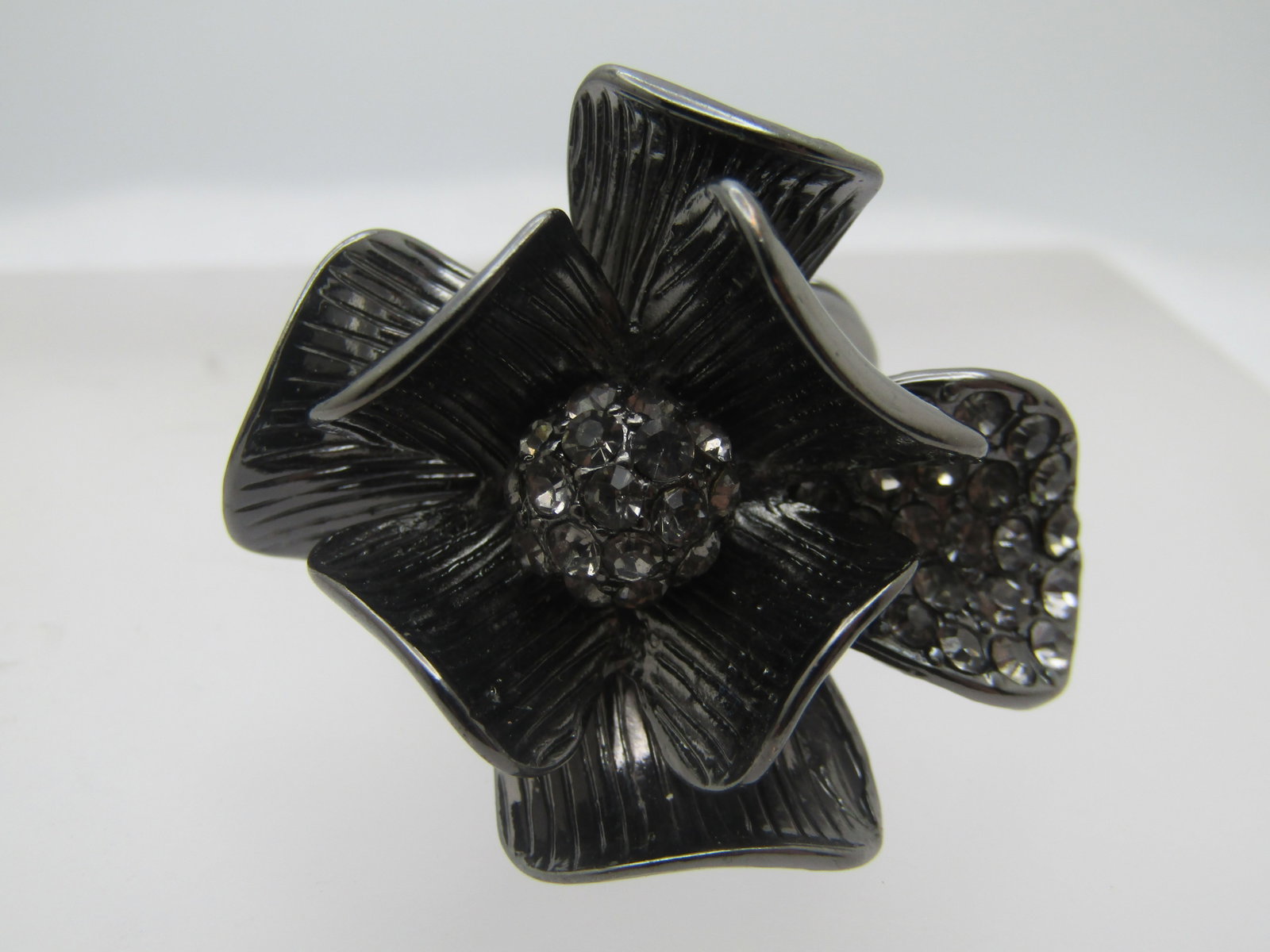 Large Rhinestone Flower Blossom Ring, Adjustable, 1990's-2000's: Title: Large Rhinestone Flower Blossom Ring, Adjustable, 1990's-2000's Description: Large Rhinestone Flower Blossom Ring, Adjustable, 1990's-2000's. Titanium toned stretch ring - can wear on any