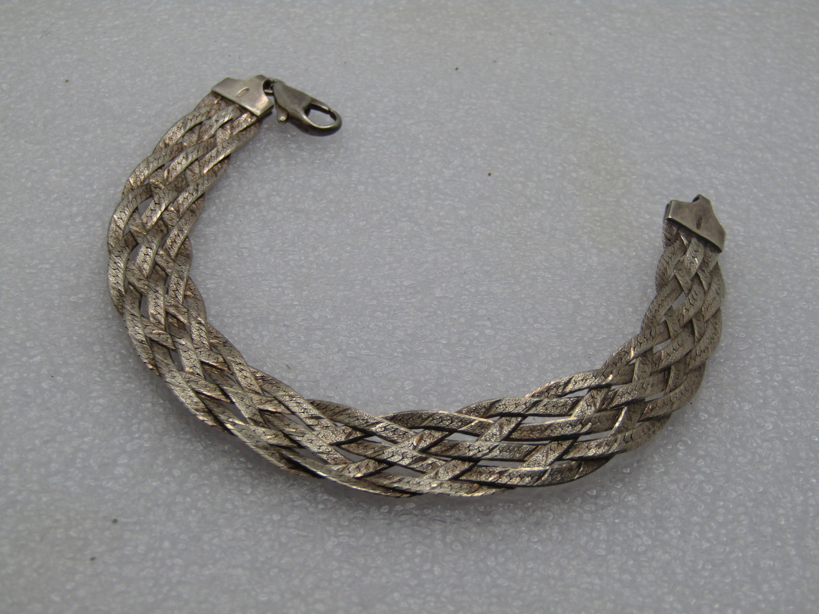 Vintage Sterling Braided Herringbone Bracelet, 5 Strands, 1980's, 7",: Title: Vintage Sterling Braided Herringbone Bracelet, 5 Strands, 1980's, 7", Description: Vintage Sterling Braided Herringbone Bracelet, 5 Strands, 1980's, 7", It is slightly over 1/2" wide with the s