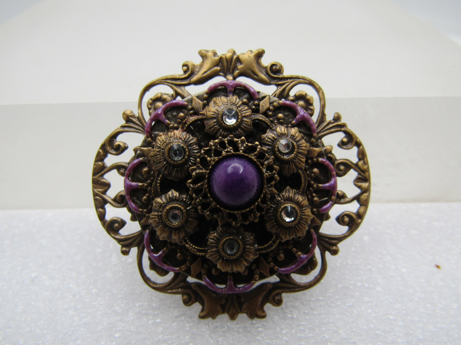 Vintage Filigree Tiered Enameled Brooch, Rhinestone Accents, 1980's: Title: Vintage Filigree Tiered Enameled Brooch, Rhinestone Accents, 1980's Description: Vintage Filigree Tiered Enameled Brooch, Rhinestone Accents, 1980's. There are four tiers - filigree base that i