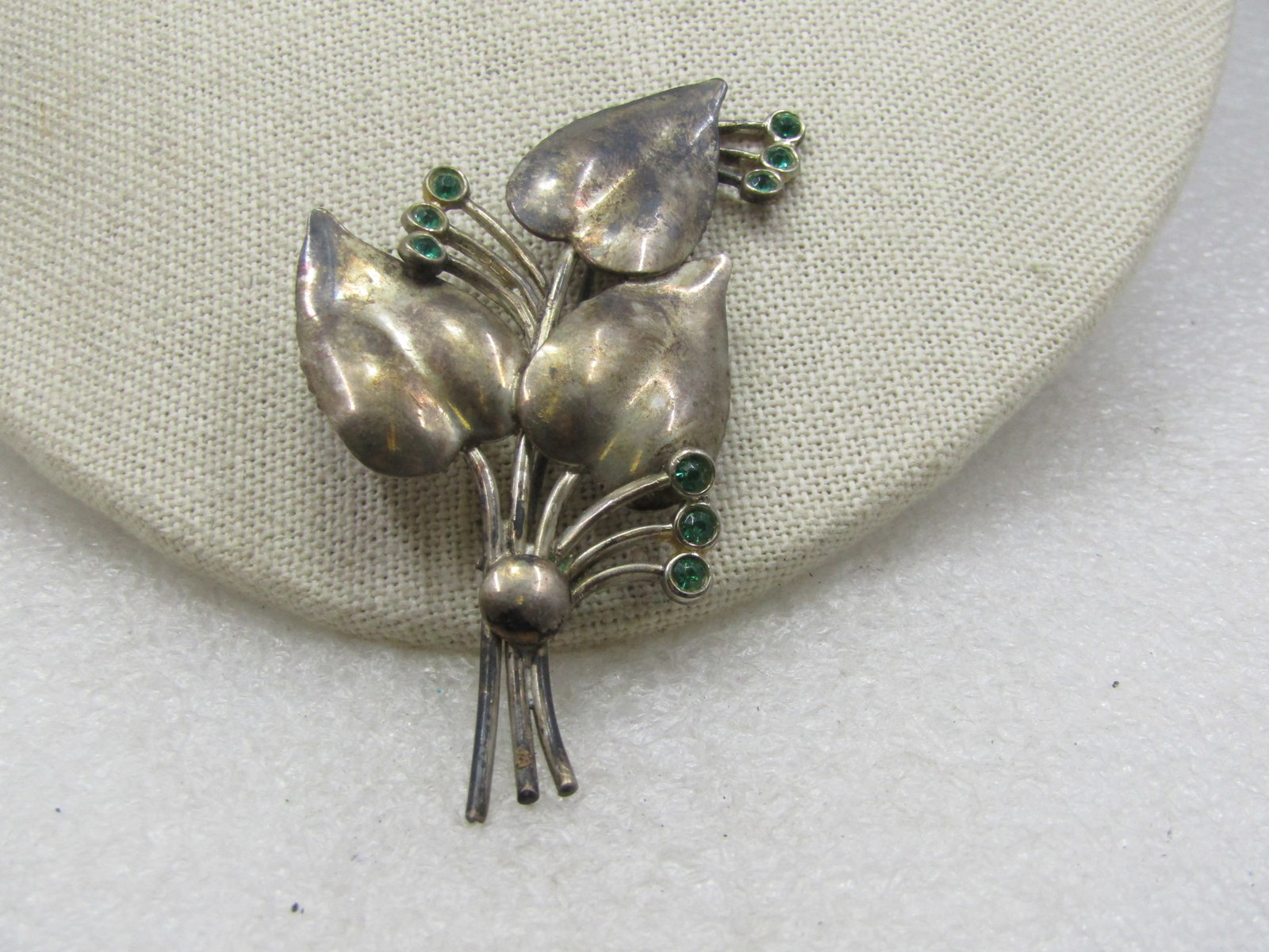Vintage Sterling Leaf Stem & Rhinestone Brooch, 1940's, 3": Title: Vintage Sterling Leaf Stem & Rhinestone Brooch, 1940's, 3" Description: Vintage Sterling Leaf Stem & Rhinestone Brooch, 1940's, 3". This has there leaves and their stems with three green rhines