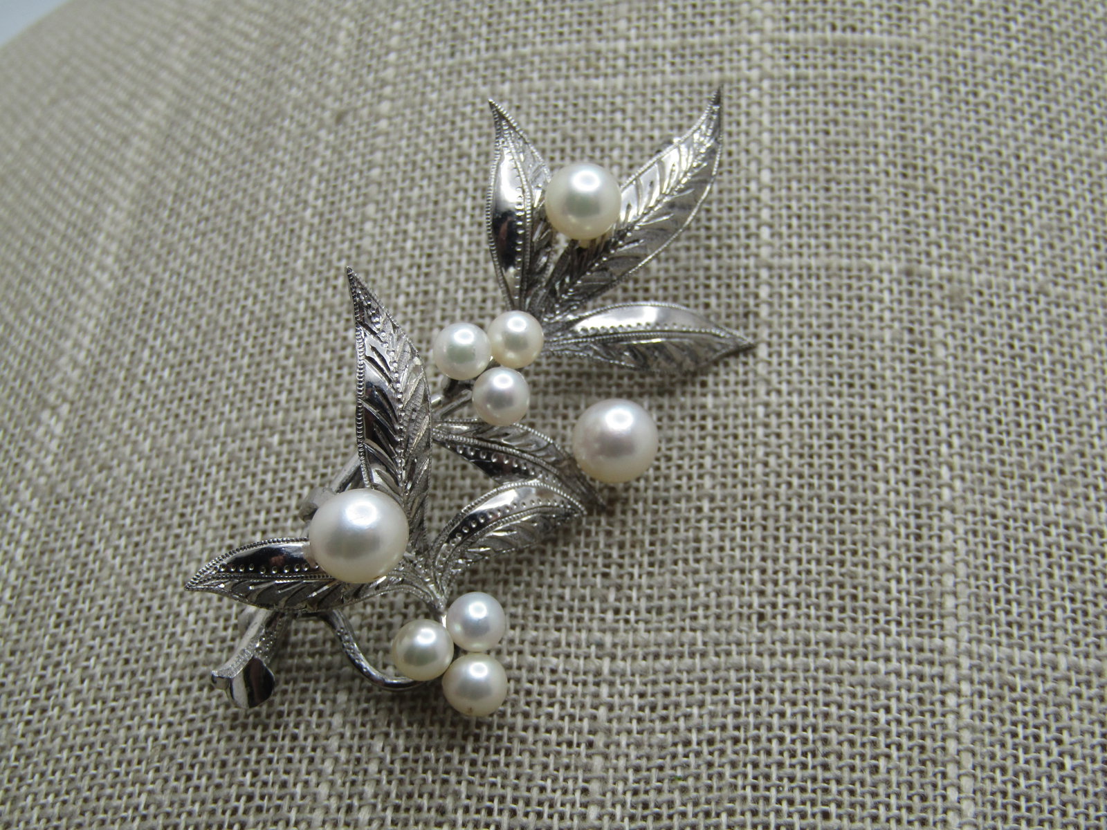 Vintage Sterling Pearl Leaf Stem Brooch, 2.25", 1960's-1970's: Title: Vintage Sterling Pearl Leaf Stem Brooch, 2.25", 1960's-1970's Description: Vintage Sterling Pearl Leaf Stem Brooch, 2.25" tall and 1.25" wide. , 1960's-1970's. It is signed sterling. It has bee