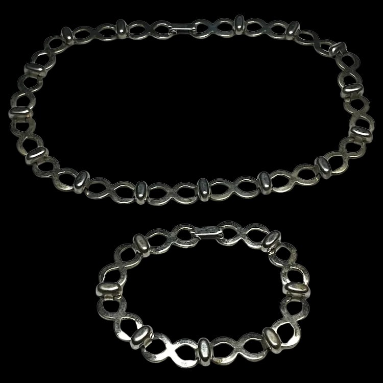 Vintage Dufoe Figure Eight, Eternity, Necklace and Bracelet Set: Title: Vintage Dufoe Figure Eight, Eternity, Necklace and Bracelet Set Description: Vintage Dufoe Figure Eight, Eternity, Necklace and Bracelet Set. Metal. Necklace Measures 15 inches Bracelet Measure