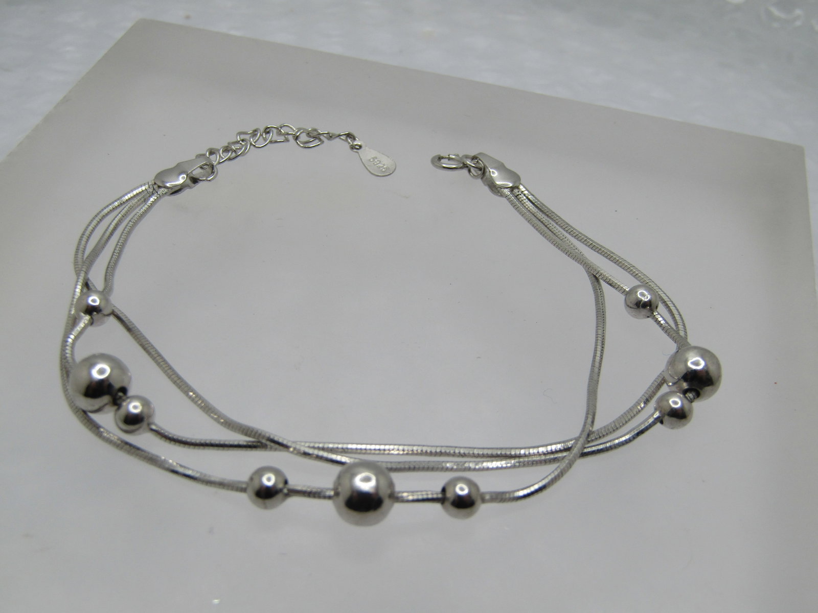 Triple strand Beaded Bracelet, Herringbone, 8", 1990's, Marked .925: Title: Triple strand Beaded Bracelet, Herringbone, 8", 1990's, Marked .925 Description: Triple strand Beaded Bracelet, Herringbone, 8", 1990's, Marked .925. This is marked sterling in two places. The 