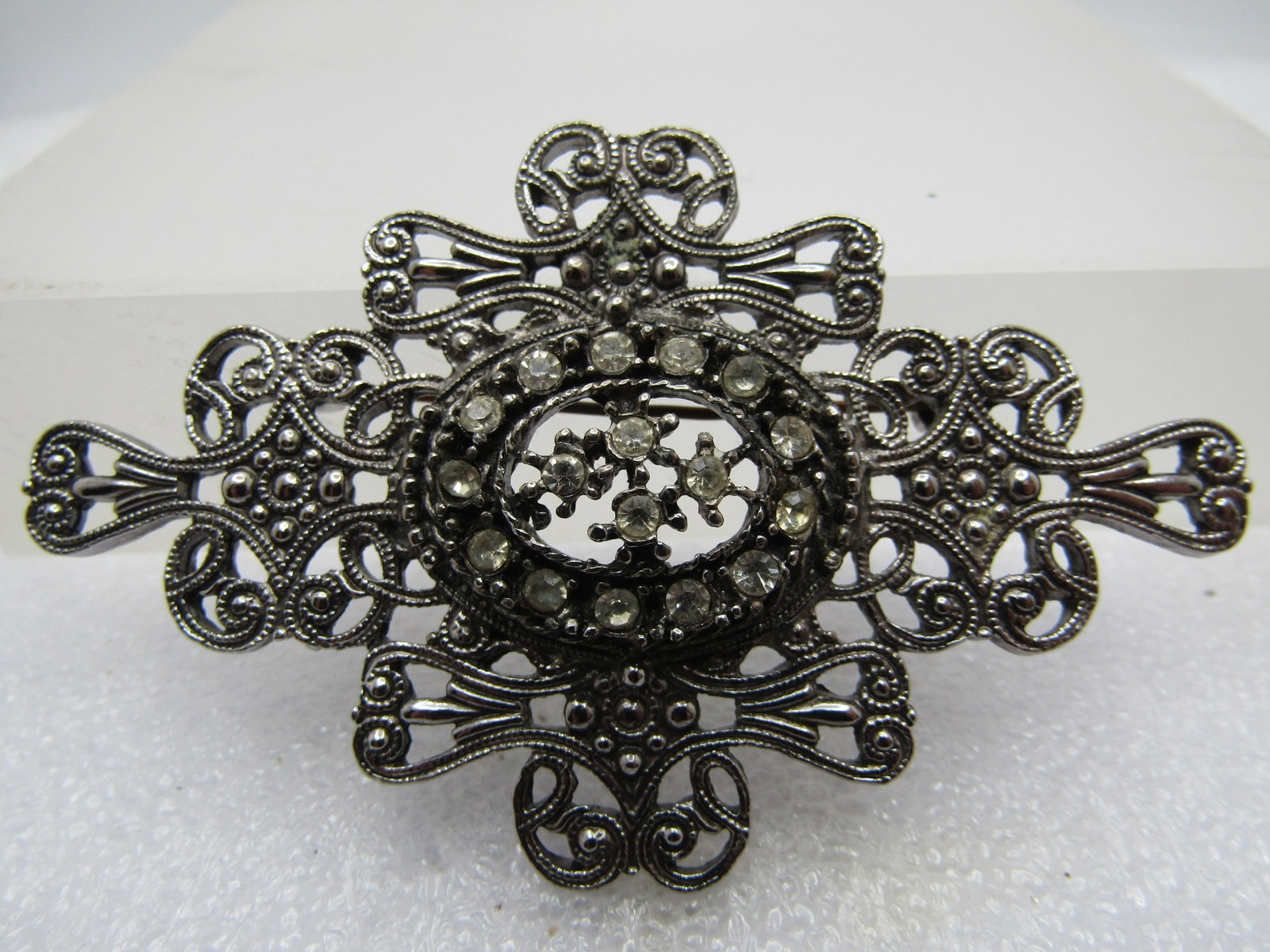 Vintage Scrolled & Rhinestone Brooch, Victorian Themed, 1970's-1980's: Title: Vintage Scrolled & Rhinestone Brooch, Victorian Themed, 1970's-1980's Description: Vintage Scrolled & Rhinestone Brooch, Victorian Themed, 1970's-1980's. 3" wide and 1.75" tall. Scrolled base w