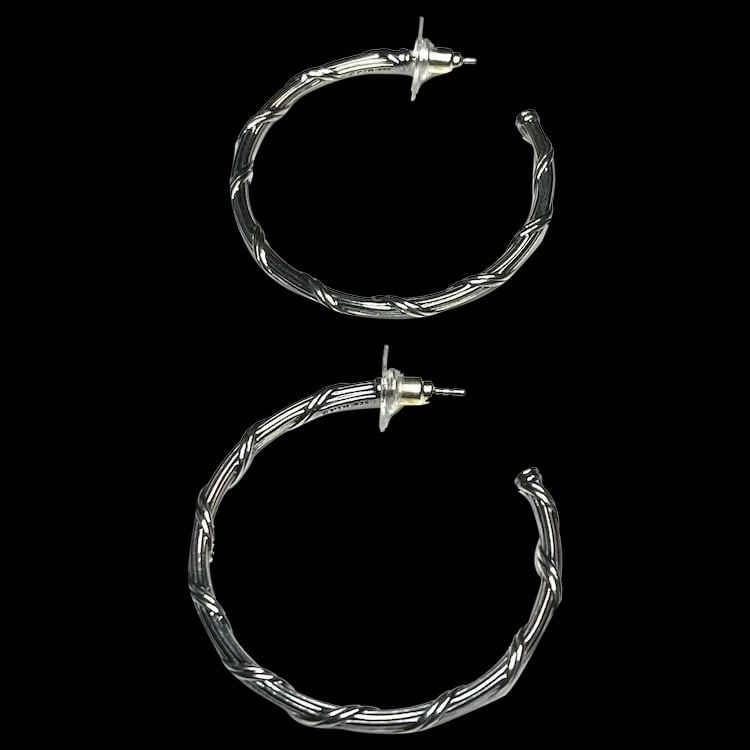 Estate Sterling Silver Twisted Hoop Earrings: Title: Estate Sterling Silver Twisted Hoop Earrings Description: Estate Sterling Silver Twisted Hoop Earrings. Sterling Silver. Weighs 10 grams. Pierced Earrings. Measures Approx. 1.5 inches x 1.5
