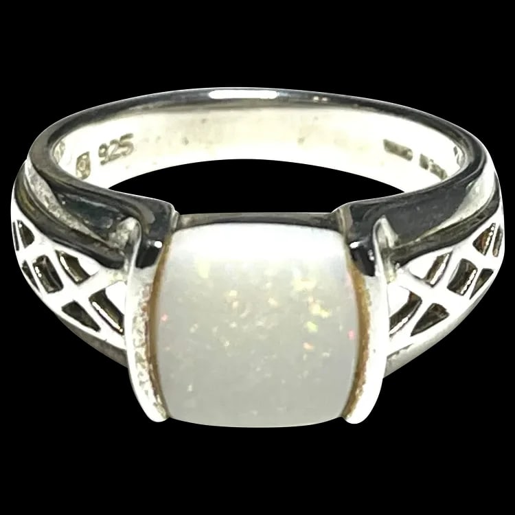 Estate Sterling Silver Opal Ring: Title: Estate Sterling Silver Opal Ring Description: Estate Sterling Silver Opal Ring. Hallmarked: 925 Made in China. Weighs: 6 grams. Measures US Ring Size: 9 Date/Period: Estate Materials: Hallmarke