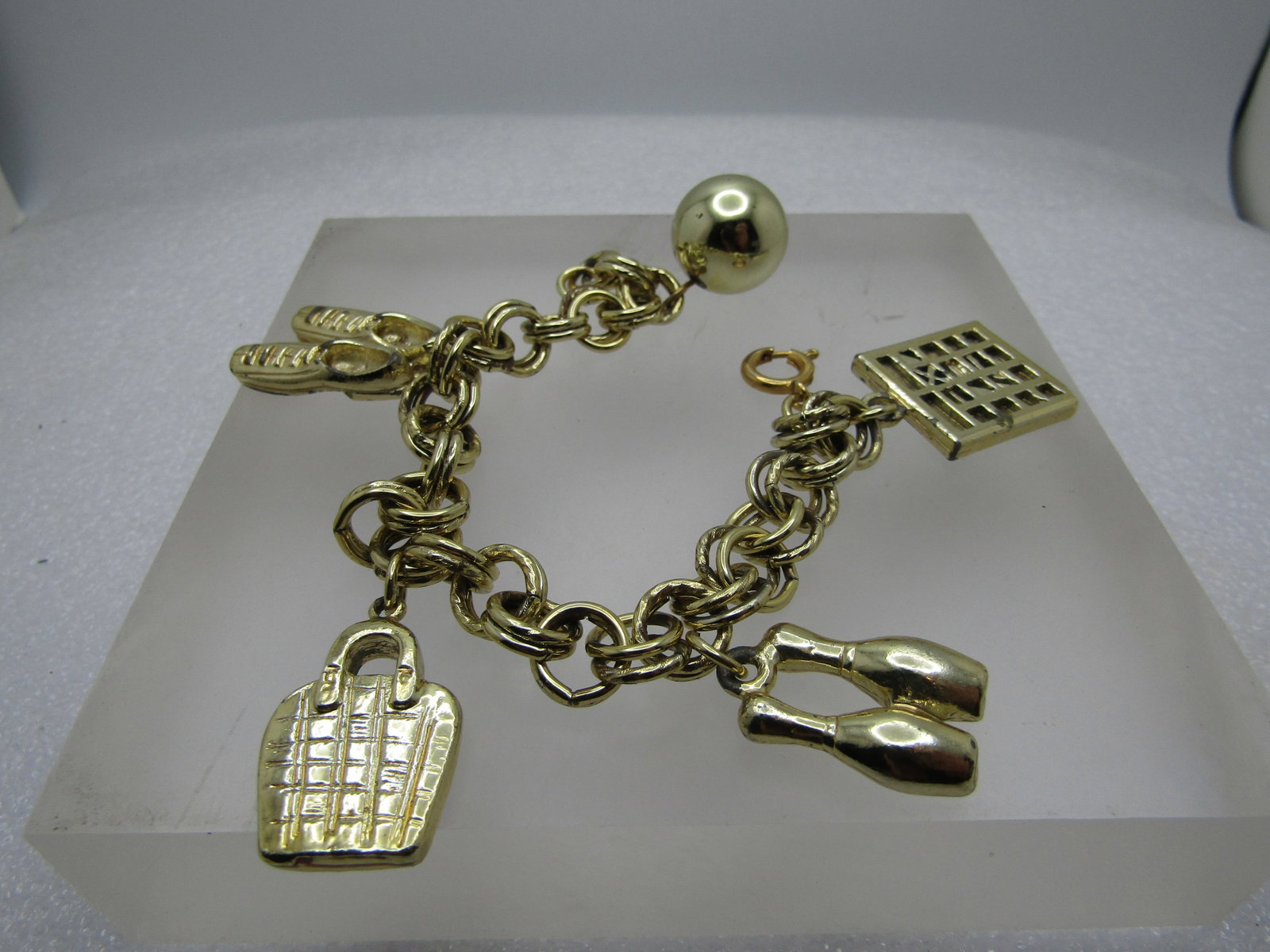 Vintage Bowling Charm Bracelet, 7", 1960's-1970's: Title: Vintage Bowling Charm Bracelet, 7", 1960's-1970's Description: Vintage Bowling Charm Bracelet, 7", 1960's-1970's, gold tone. The bracelet is a double link that is appx. 9mm wide with spring cla