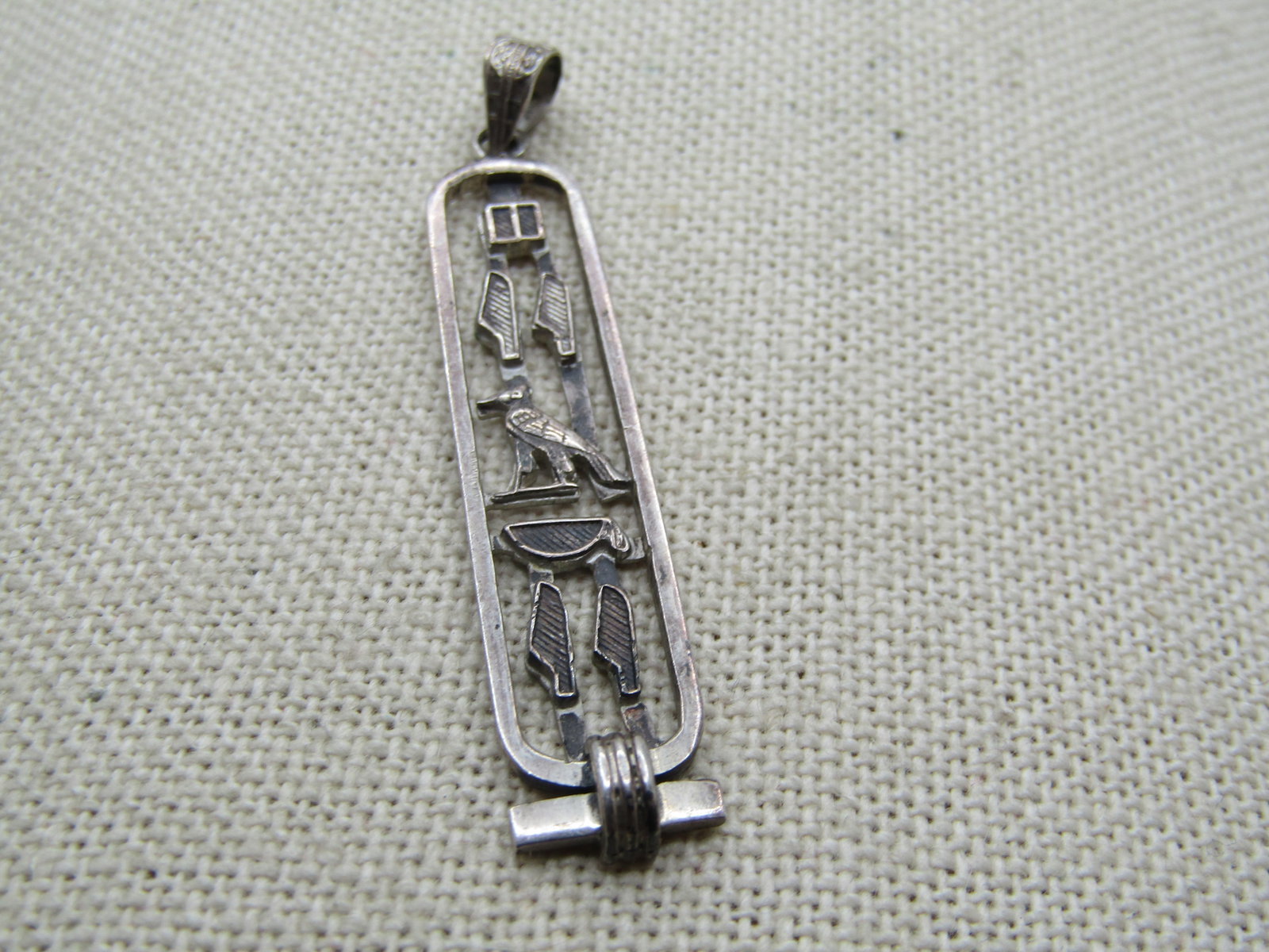 Vintage Sterling Egyptian Cartouche Pendant, 2-1/8" tall and appx. 1/2" wide. 1980's.: Title: Vintage Sterling Egyptian Cartouche Pendant, 2-1/8" tall and appx. 1/2" wide. 1980's. Description: Vintage Sterling Egyptian Cartouche Pendant, 2-1/8" tall and appx. 1/2" wide. 1980's. It has