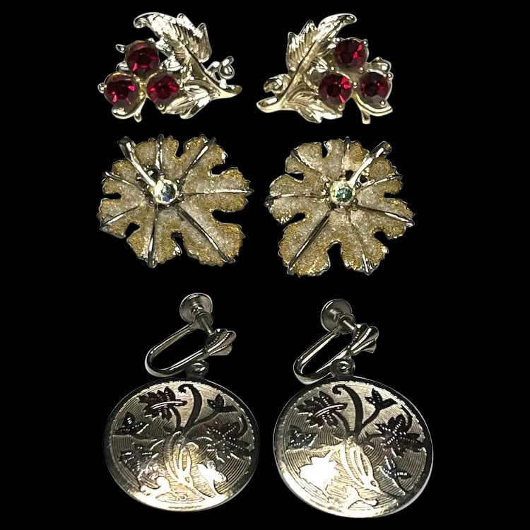 Vintage Lot of Earrings: Title: Vintage Lot of Earrings Description: Vintage Lot of Earrings. 2 Clip-on Earring Sets, 1 Screw-back Earring Set Date/Period: Vintage Materials: Metal Size: Varies Reserve: $30.00 Shipping: