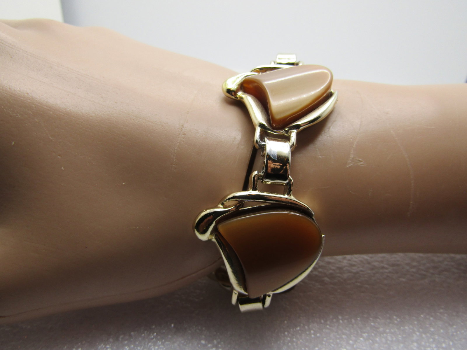 Vintage Brown Thermoset Bracelet, 1960's, 7": Title: Vintage Brown Thermoset Bracelet, 1960's, 7" Description: Vintage Brown Thermoset Bracelet, 1960's, 7". The shape of the brown stones are like the "Comedy and Tragedy" shapes. They areset in a 