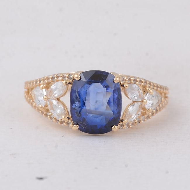 3.70 Ct Cushion Sapphire 9K Gold Ring: Description3.70 Total Carat Sapphire 9K Gold RingSpecifications:Total Weight 2.491 gCenter Gemstone SapphireGemstone Carat Weight 2.67 CaratsGemstone Measurements 9X7.30X4 mmAdditional Gemstones White