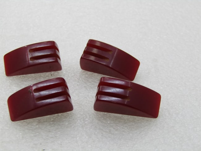 Vintage 4 Deep Red Bakelite Buttons, Wedged, Grooved, 1": Vintage 4 Deep Red Bakelite Buttons, Wedged, Grooved, 1" with two carved grooves in the top of the button. These are appx. 1/2" thick. Deep red to maroon in color with a metal eye hook in the back to 
