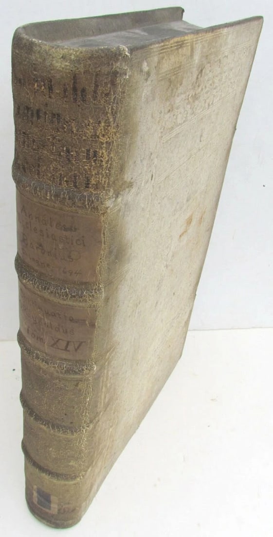 1694 BLIND-STAMPED PIGSKIN OVER WOODEN BOARDS FOLIO ANNALES ECCLESIASTICI: Very good condition. Binding with some discoloration. Intact. Pages with foxing and toning. Clasps are in good shape. Ex-library. Size 10 by 15.5''. Latin text. . (342)