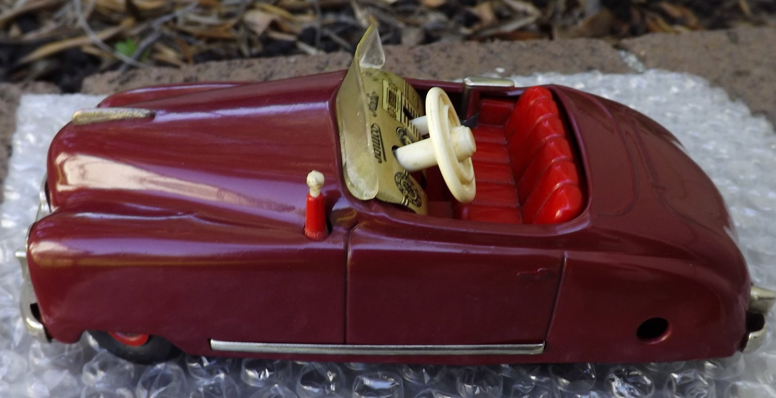 Schuco Radio 4012 (made in US Zone Germany,) two windup motors, one propels the car, the other one: Schuco Radio 4012 (made in US Zone Germany,) two windup motors, one propels the car, the other one propels a music box (the "radio"), rack and pinion steering, functional handbrake, c9.5 . Reserve: $2