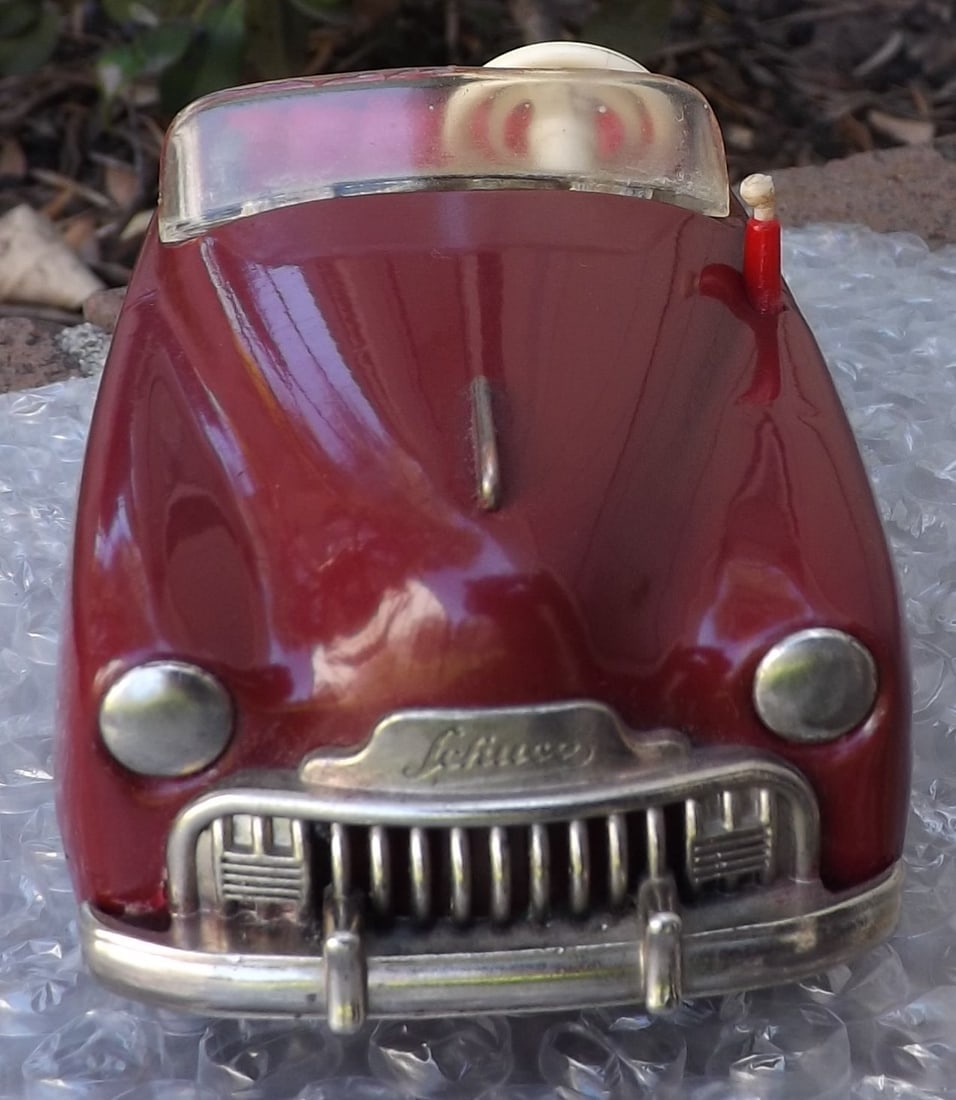 Schuco Radio 4012 (made in US Zone Germany,) two windup motors, one propels the car, the other one - 2