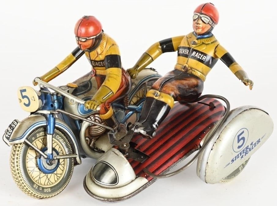 Tippco motorcycle Silver Racer (Made in Germany), c10, with original box , When wound up, the wheel: Tippco motorcycle Silver Racer (Made in Germany), c10, with original box , When wound up, the wheel steers to left and passenger swings out to balance the bike through turn, the wheel straightens and 