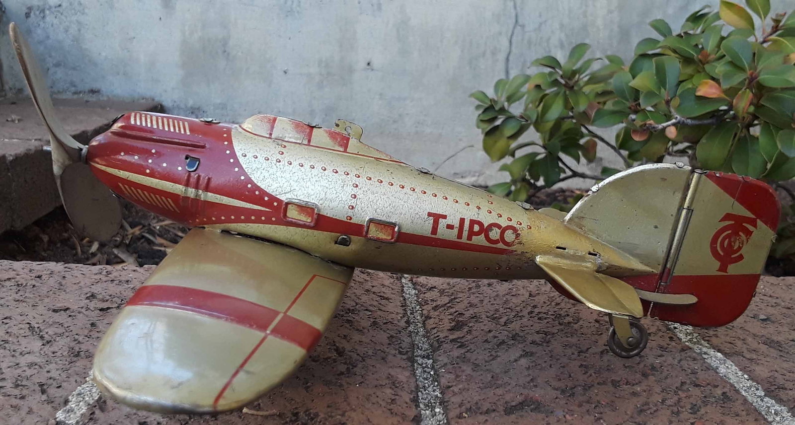 Tippco civilian airplane, the much rarer gold-red combination with moving tail, c8.: Tippco civilian airplane, the much rarer gold red combination with moving tail, c8. Reserve: $480.00 Shipping: Domestic: Flat rate of $45.00 to anywhere within the contiguous U.S. International: