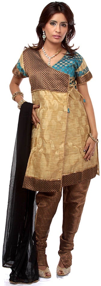 Beige Angarakha Chudidar Suit with Beadwork: Title:Beige Angarakha Chudidar Suit with Beadwork Description:Angarakha in traditional Indian fashion was the attire of the royals, who wrapped themselves in over-alls of pure silk, muslin, mulmul,