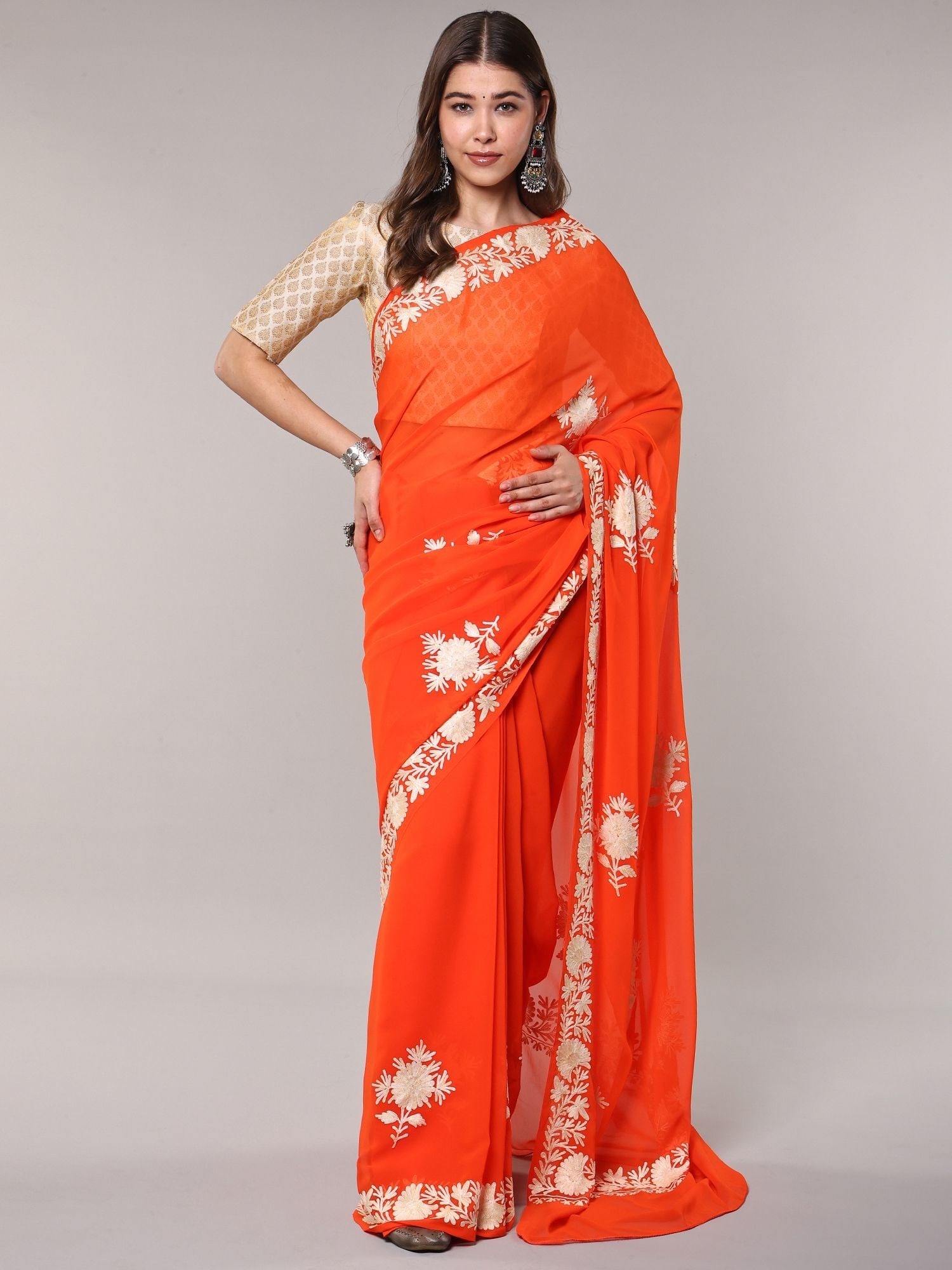 Tangerine-Tango Georgette Saree with Aari Embroidered Flowers from Kashmir: Title:Tangerine-Tango Georgette Saree with Aari Embroidered Flowers from Kashmir Reference:itemcode : CA0015 Reserve: $94.00 Shipping: Domestic: Shipping rates are determined by destination