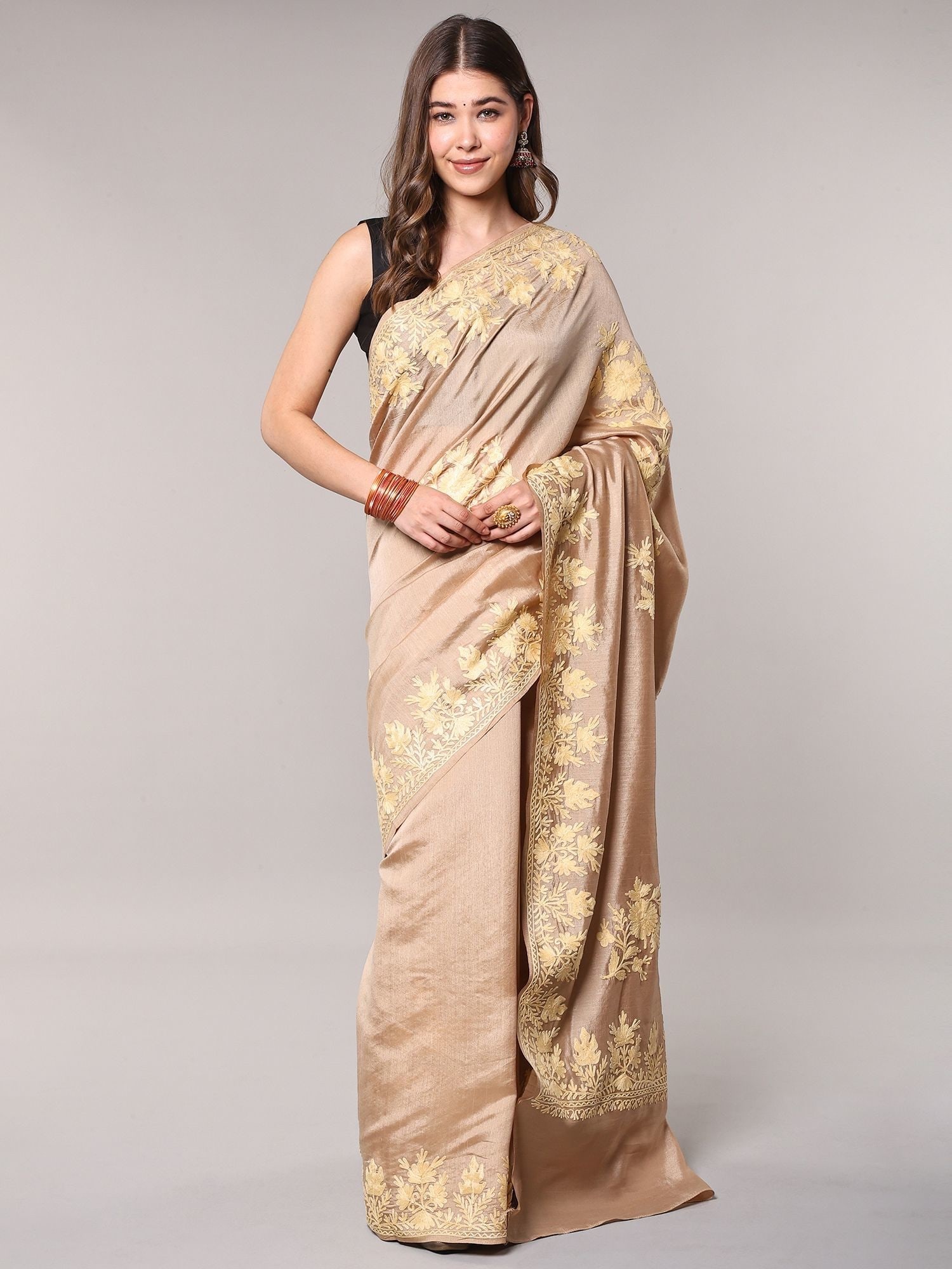 Irish-Cream Kashmiri Saree with Aari Embroidered Floral Motifs and Maple Border: Title:Irish-Cream Kashmiri Saree with Aari Embroidered Floral Motifs and Maple Border Reference:itemcode : CA0004 Reserve: $135.00 Shipping: Domestic: Shipping rates are determined by destination