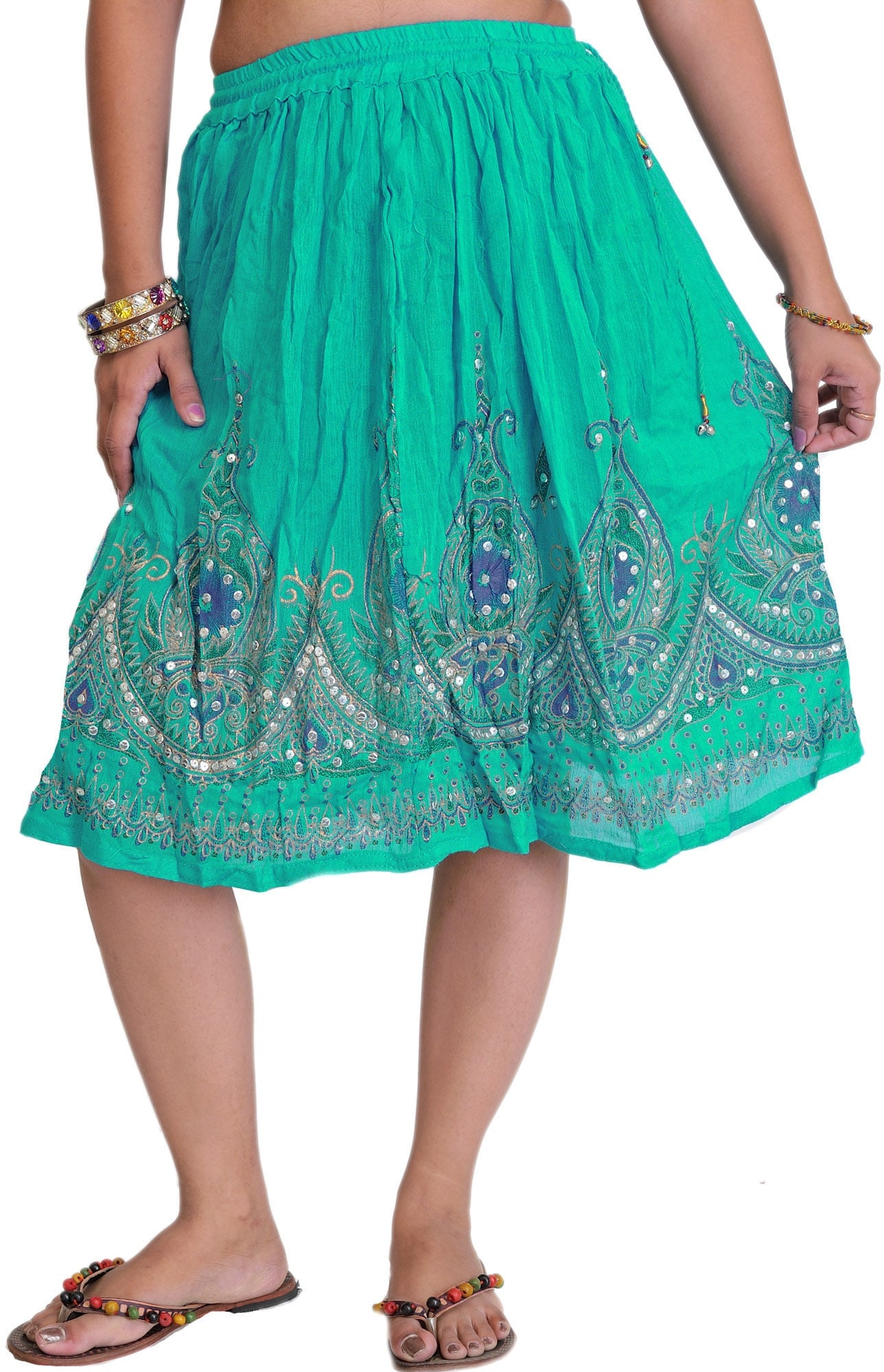 Short Skirt with Printed Flowers and Embroidered Sequins: Title:Short Skirt with Printed Flowers and Embroidered Sequins Description:This garment, crafted from the finest pure cotton, is a poetic fusion of elegance and vibrancy. This creation transcends
