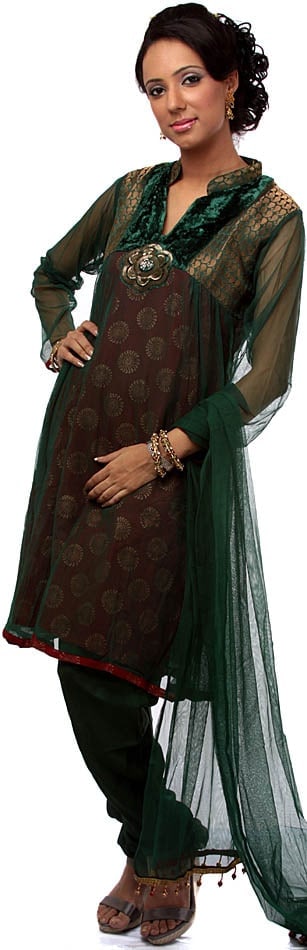 Green Brocaded Chudidar Suit with Velvet and Sequins Embroidered as a Flower: Title:Green Brocaded Chudidar Suit with Velvet and Sequins Embroidered as a Flower Description:A bold and stylish combination of fabrics- velvet, net, brocade, gives this Chudidar salwar kameez a gorg