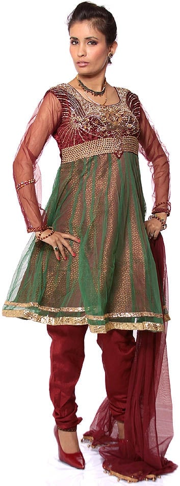 Maroon Wedding Anarkali Suit with Heavy Beadwork on Bust: Title:Maroon Wedding Anarkali Suit with Heavy Beadwork on Bust Description:The timeless charm of net in adding volume and layers to ethnic Indian wear has made it a favorite element in wedding