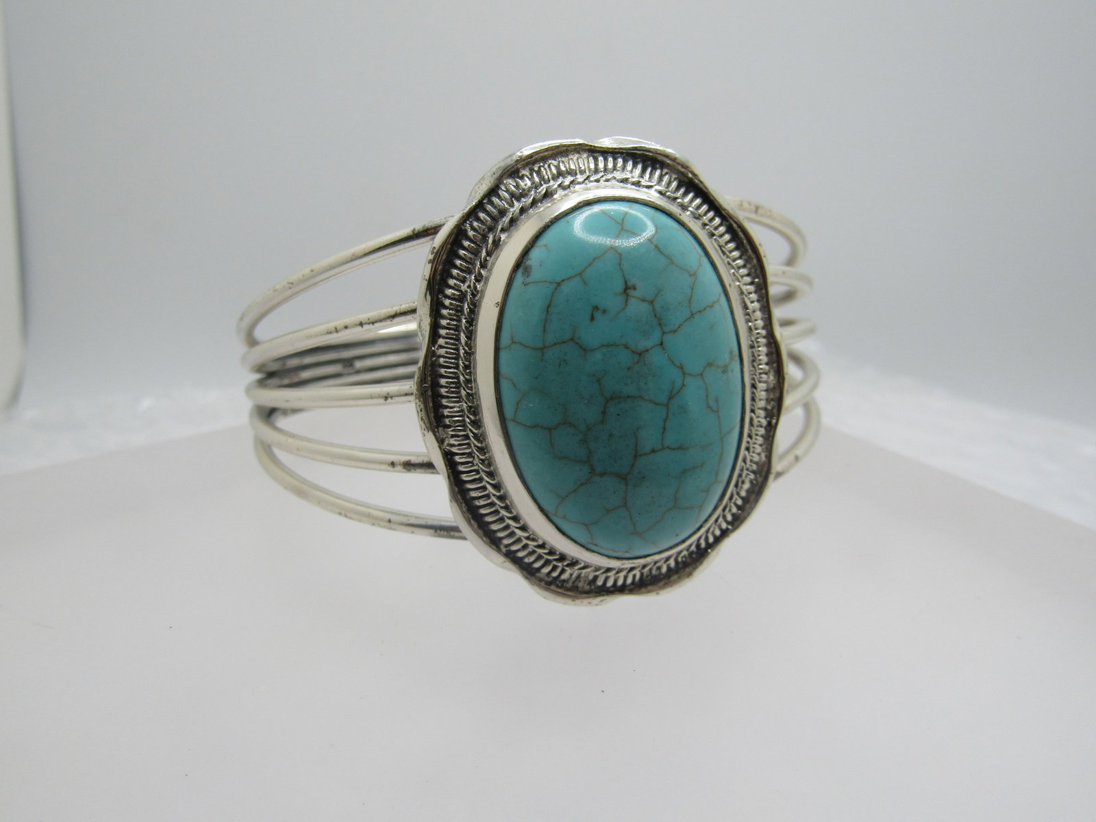 Sterling Southwestern Turquoise Cuff Bracelet, 7.5", Unisex: Sterling Southwestern Turquoise Cuff Bracelet, 7.5", Unisex. The bracelet has a large turquoise with tan matrix, spiderweb-ish, and appx. 29mm by 23mm with an angeled bzel around the stone, followed