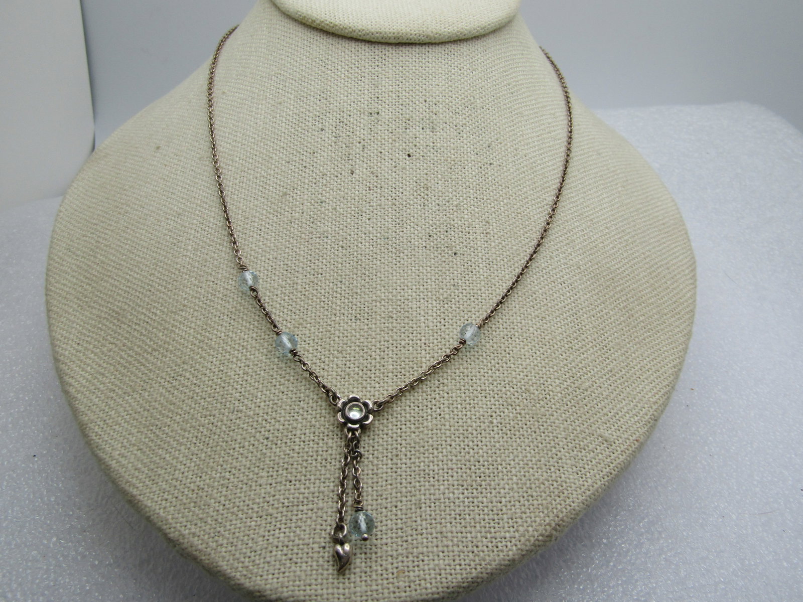 Vintage Sterling Blue Topaz Necklace, Floral Lavalier, 17.5", Signed ALE (Pandora) 1980's-1990's: Vintage Sterling Blue Topaz Necklace, Floral Lavalier, 17.5", Signed ALE (Pandora) 1980's-1990's. The faceted pale blue beads are appx. 4mm and test as blue topaz. there is a round cabchon bezel-set i