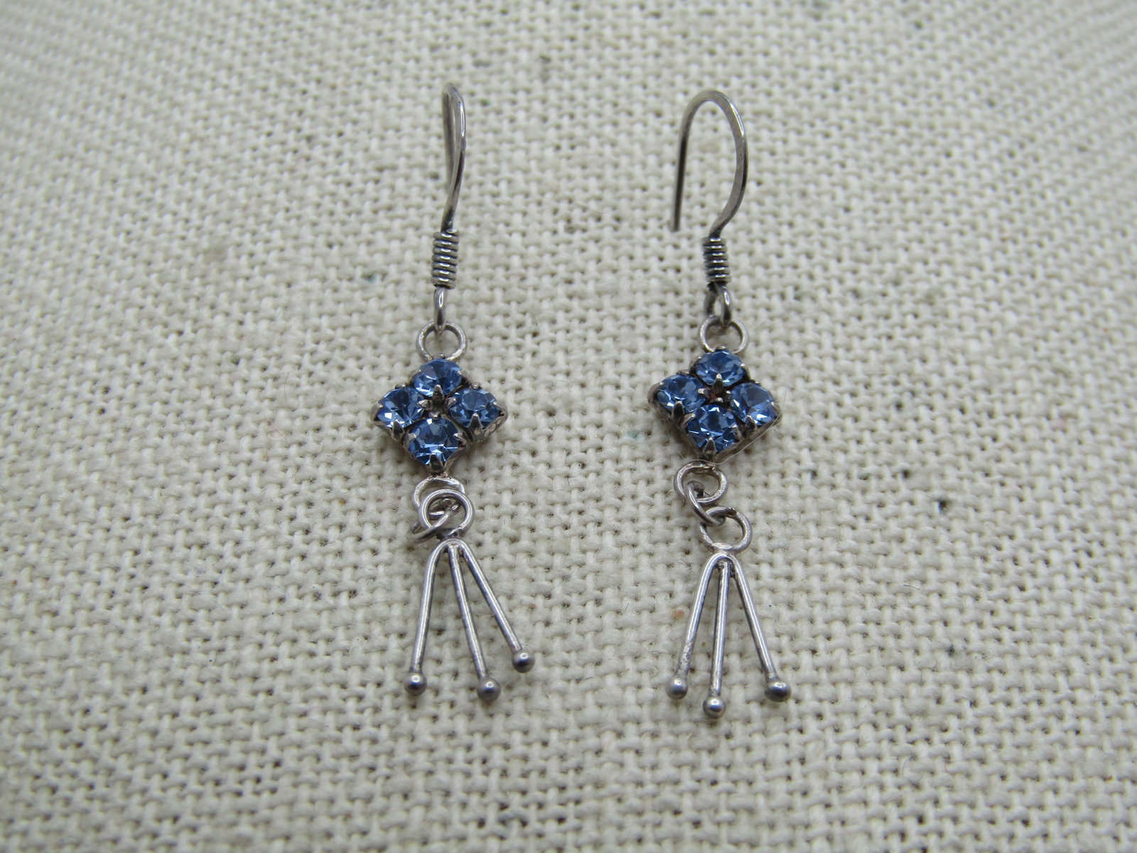 Vintage Sterling Rhinestone Drop Earrings, 1960's-1980's: Vintage Sterling Rhinestone Drop Earrings, 1960's-1900's. Petite sterling earrings with a fishhook post with a four blue rhinestone square setting and from that danges a triple strand drop with beaded
