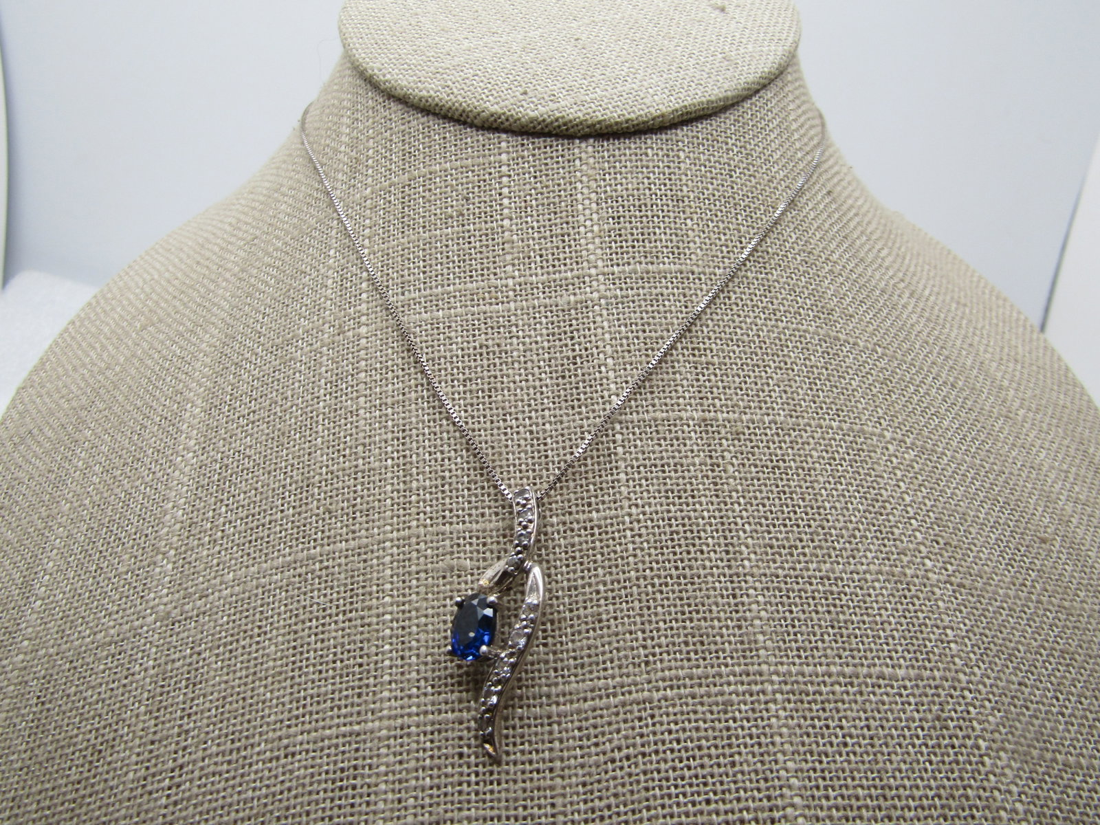 Sterling Blue Sapphire White Topas Wispy Necklace, 18" Signed: Sterling Blue Sapphire White Topas Wispy Necklace, 18" Signed D. Indian on the clasp and signed with a mark on the back of the pendant and marked .925. Tests as .925 with a weight of appx. 3.33 gr. Th