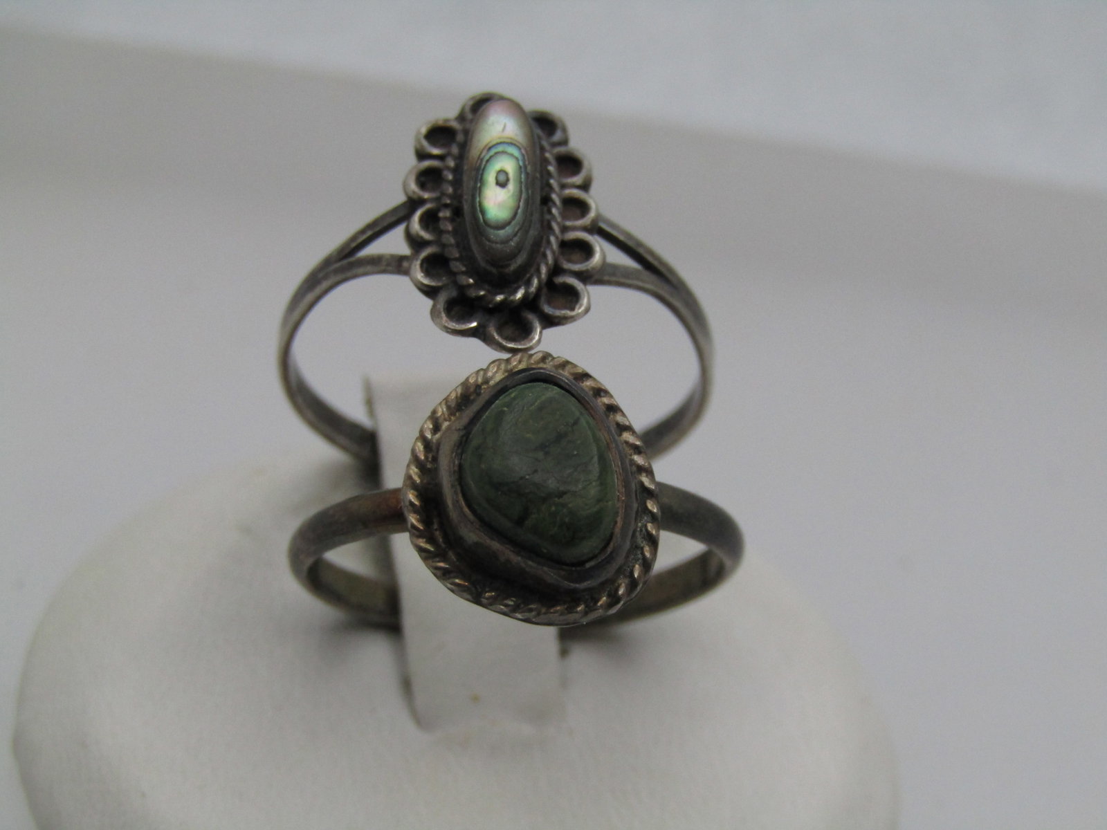 Vintage 2 Sterling Southwestern Rings, Sz. 8, Abalone & Green Stone, 1960's-1970's: Vintage 2 Sterling Southwestern Rings, Sz. 8, Abalone & Green Stone, 1960's-1970's. One ring has an elongated abalone that is appx. 8.5mm by 3.5mm, bezel set with rope frame at the base of the bezel