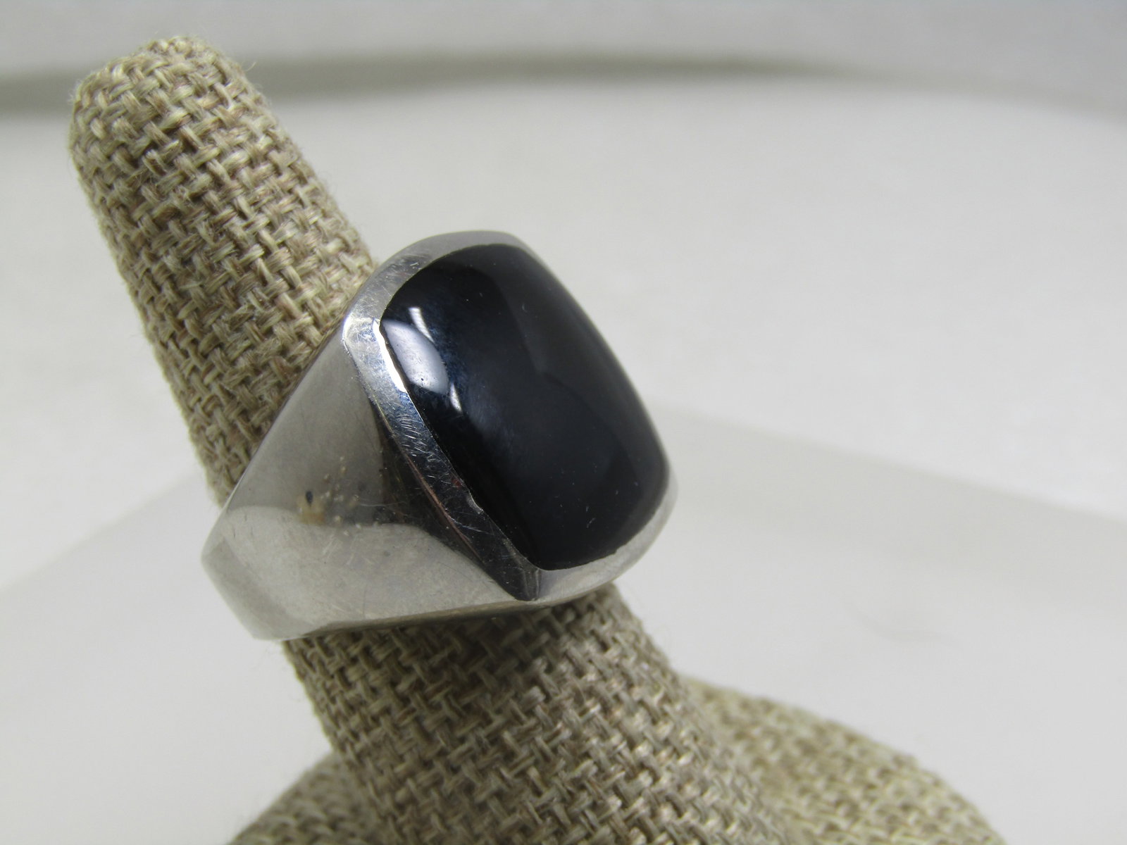 Stainless Steel Black Stone Ring, Sz. 8, Men's/Unisex,: Stainless Steel Black Stone Ring, Sz. 8, Men's/Unisex. This is a current ring design and not vintage. It has a large black stone, believed to be onyx as it does not test as glass, is bezel-set and app