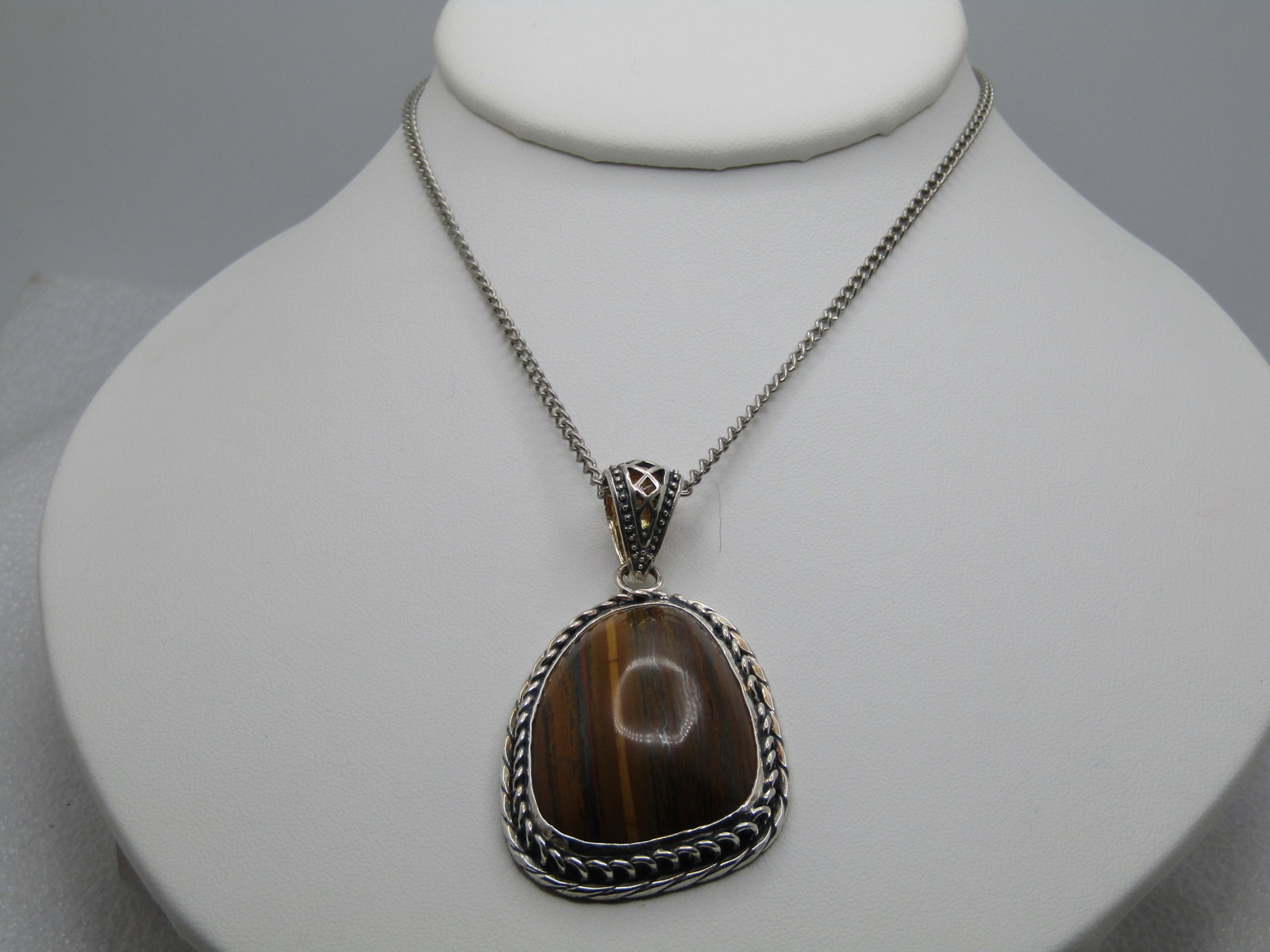 Southwestern Tiger's Eye Necklace, 18", 1990's-2000, Silver Tone: Southwestern Tiger's Eye Necklace, 18", 1990's-2000, Silver Tone. This is marked .925 but does not test as sterling on the pendant or the chain. Still, very nice with a great southwestern look. Chunky