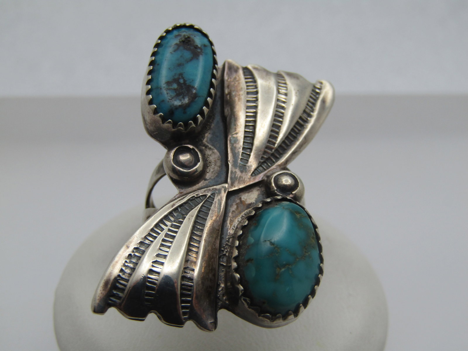 Vintage Sterling Southwestern Turquoise Ring, Sz. 6, 1970's-1980's: Vintage Sterling Southwestern Turquoise Ring, Sz. 6, 1970's-1980's. This has two bezel-set oval stones, one slightly larger than the other - appx. 13mm by 7mm and 13mm by 9mm. One is set on the top an