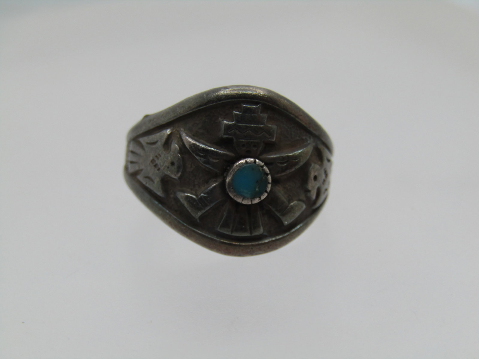 Vintage Sterling Kachina Turquoise Ring, Sz. 4.5, 1960's-1970's, Bell Trading Signed: Vintage Sterling Kachina Turquoise Ring, Sz. 4.5, 1960's-1970's, Bell Trading Signed. This has a recessed background with a raised kachina front center and a single 3mm turquoise stone also raised and