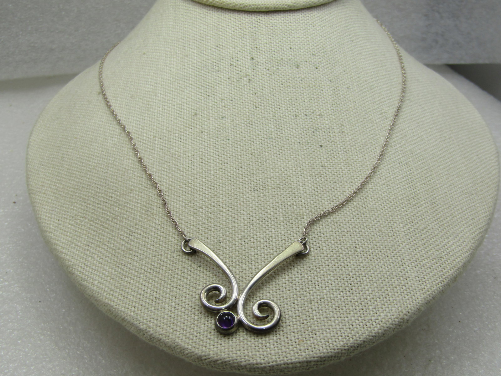 Vintage Sterling Amethyst Modernist Necklace, Poul Lysgaard Signed, 18": Vintage Sterling Amethyst Modernist Necklace, Poul Lysgaard Signed, 18". Danish silver artist, signed PSL and sterling on the back of the double offset coiled pendant with a bezel-set appx. 3.5mm amet
