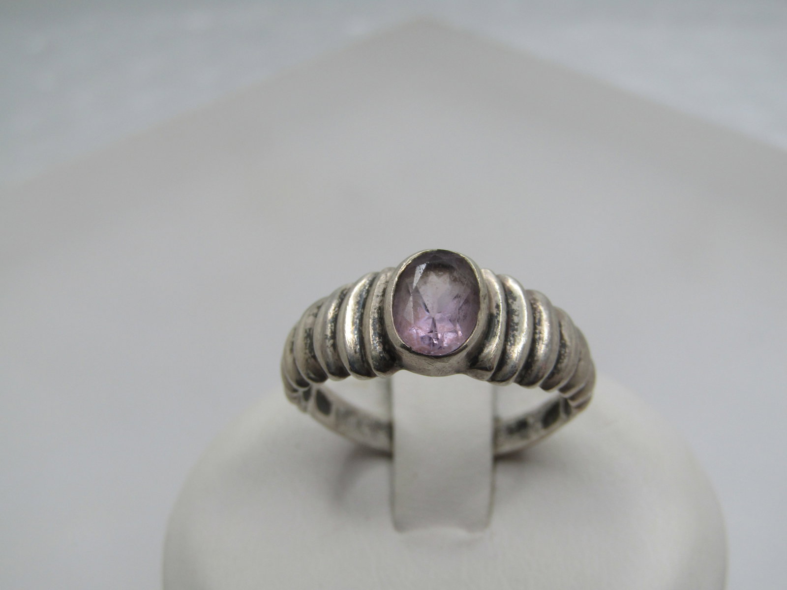 Vintage Sterling Amethyst Ring, Ridged Band, Sz. 7.75, Signed: Vintage Sterling Amethyst Ring, Ridged Band, Sz. 7.75, Signed SU. Marked .925 at 2.33 gr. Tests as sterling. The amethyst is bezel-set and slightly raised over the band. It is appx. 7mm by 5.5mm. The 